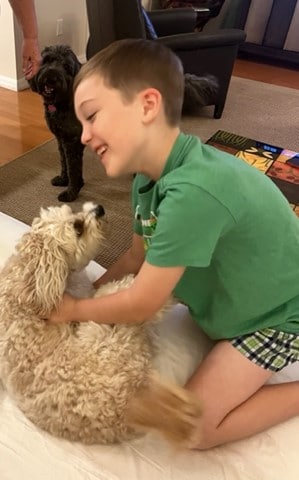 My grandson, Austin, with Parker the Cavapoo